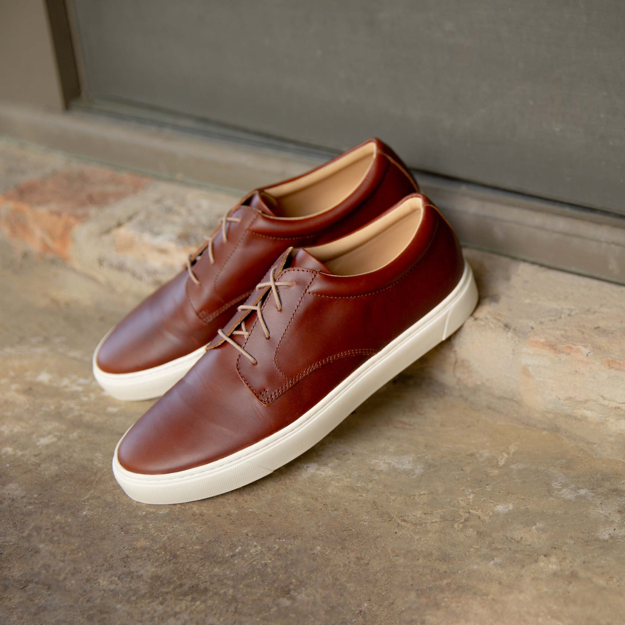 Image of the Everyday Low Top Sneaker Brandy against outdoor background